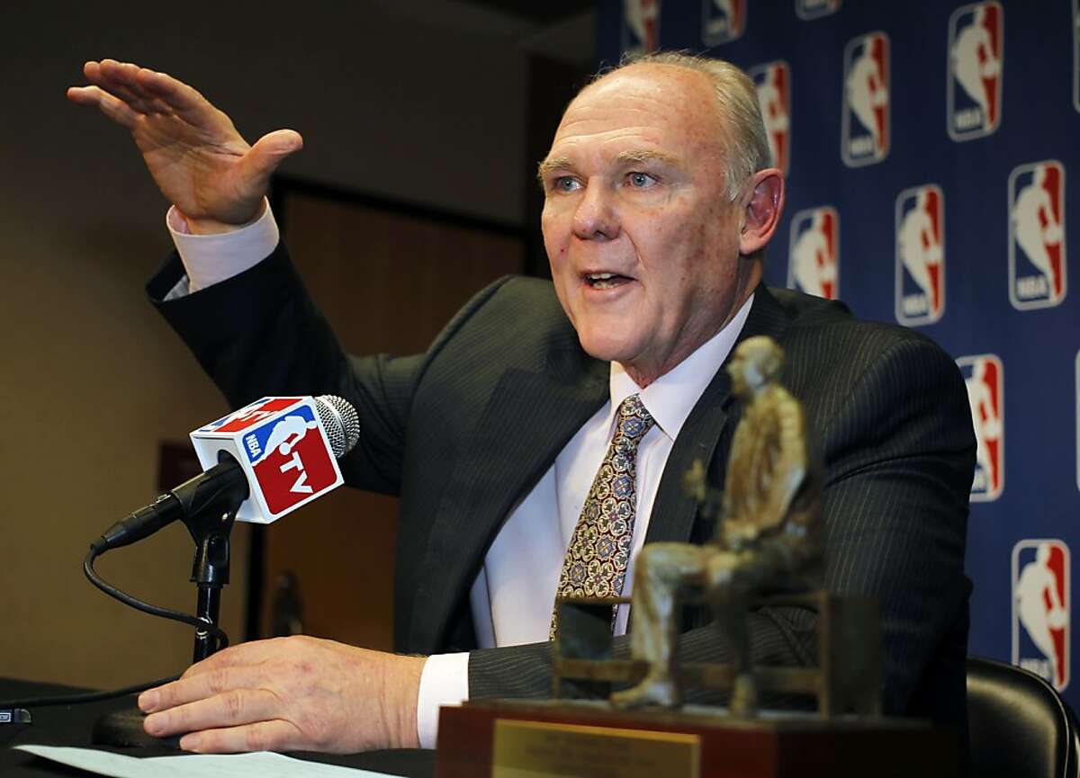 FILE - In this May 8, 2013 file photo, Denver Nuggets head coach George Karl makes a point to reporters during a news conference where he was named the NBA Coach of the Year, in Denver. Karl is out as coach of the Nuggets. Team President Josh Kroenke confirmed in an email to The Associated Press on Thursday, June 6, 2013 that Karl's tenure was over just weeks after he was named the NBA's coach of the year. (AP Photo/David Zalubowski, File)