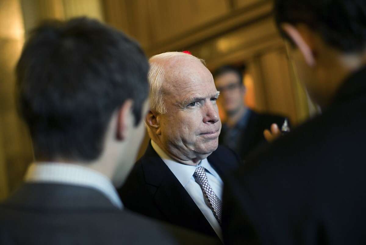 Sen. John McCain (R-Ariz.) speaks to reporters on Capitol Hill in Washington, May 22, 2013. The Senate on Wednesday passed a resolution that calls for strengthening sanctions on Iran.(Drew Angerer/The New York Times)
