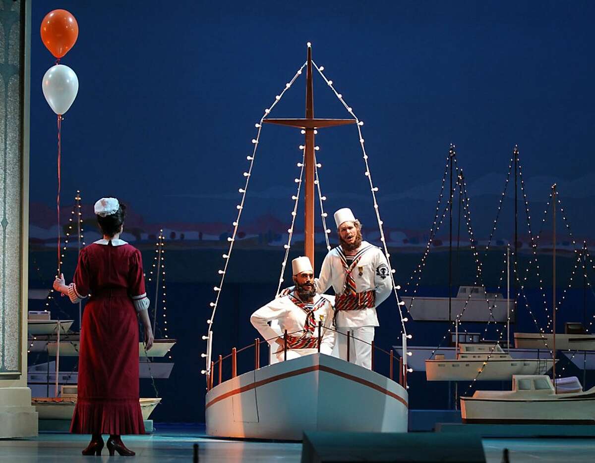 Francesco Demuro left playing Ferrando and Philippe Sly playing Guglielmo arrive on stage in a boat in San Francisco Opera production of Mozart's "Cosi Fan Tutte, Thursday, June 5, 2013 at the War Memorial Opera House in San Francisco Calif.