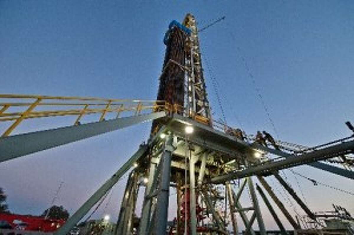 An oil & gas drilling rig is drilling a well for Pioneer Natural Resources in the Eagle Ford Shale formation near Yorktown in 2012. (Photo by Eddie Seal for The Texas Tribune