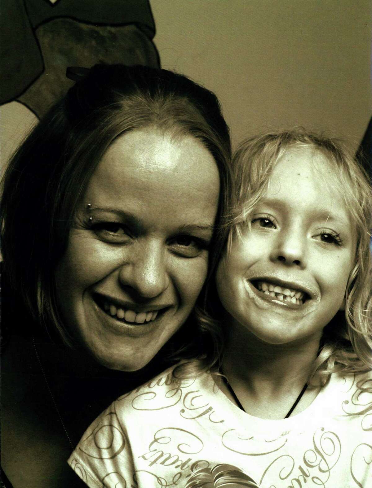 Jo-Anne Brasse (mother), now Jo-Anne Guerrero, and Sarah Brasse who died in February 2009 of untreated appendicitis at age 8.