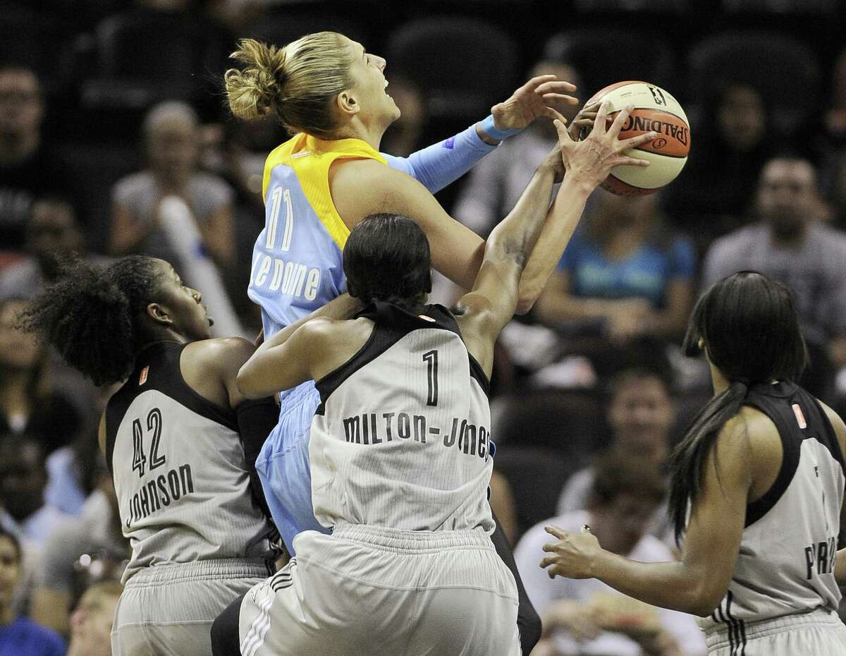Chicago star rookie Elena Delle Donne (center) is hounded by Shenise Johnson (left), DeLisha Milton-Jones and Jia Perkins of the Silver Stars in the first half Friday.