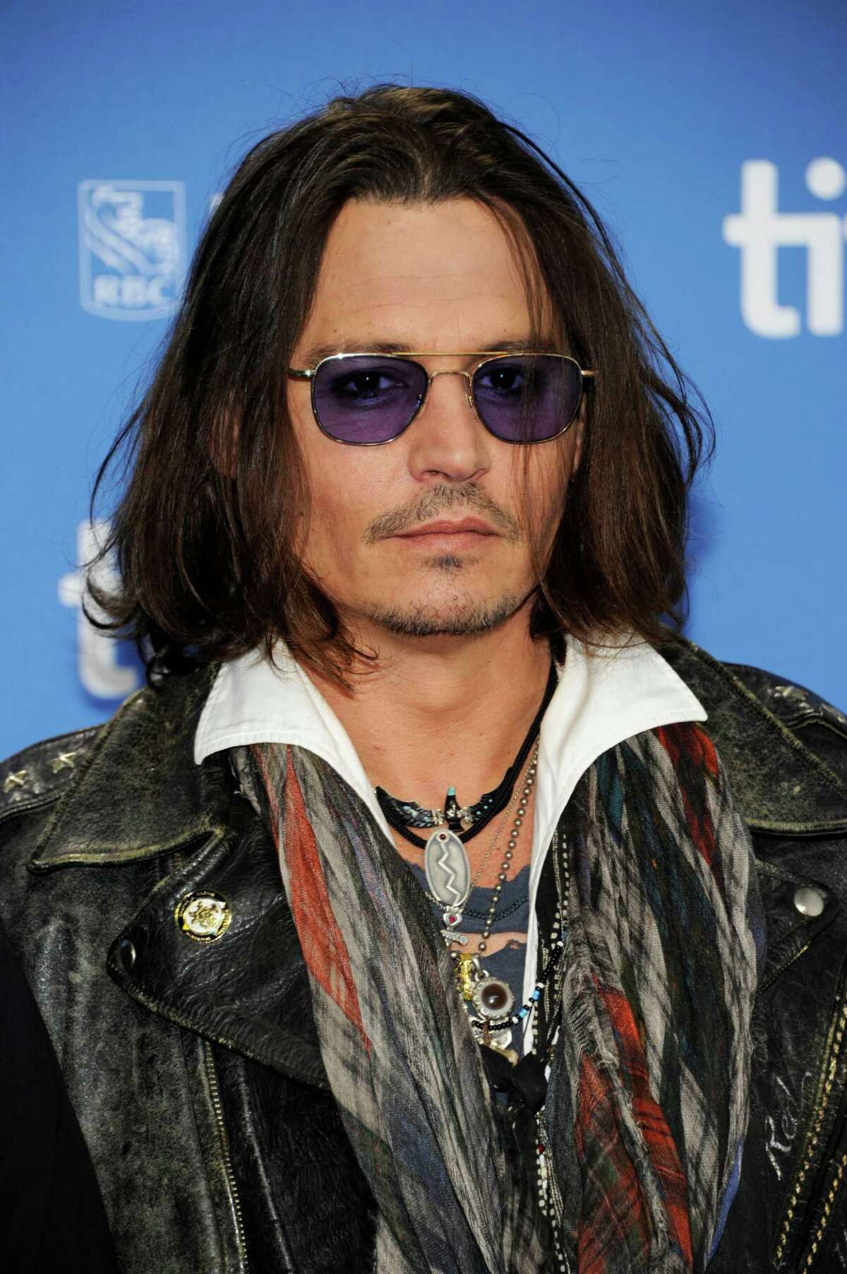 FILE - In this Sept. 8, 2012 file photo, actor Johnny Depp participates in a photo call and press conference for the film "West of Memphis" at TIFF Bell Lightbox during the Toronto International Film Festival, in Toronto. HarperCollins Publishers announced Monday, Oct. 15, 2012, that Depp will help run an imprint that will be a home for AA?“authentic, outspoken and visionaryAA?” books. (Photo by Evan Agostini/Invision/AP, File)