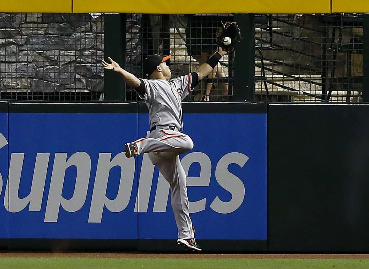 Brandon Crawford of the San Francisco Giants leaps over Joshua News  Photo - Getty Images