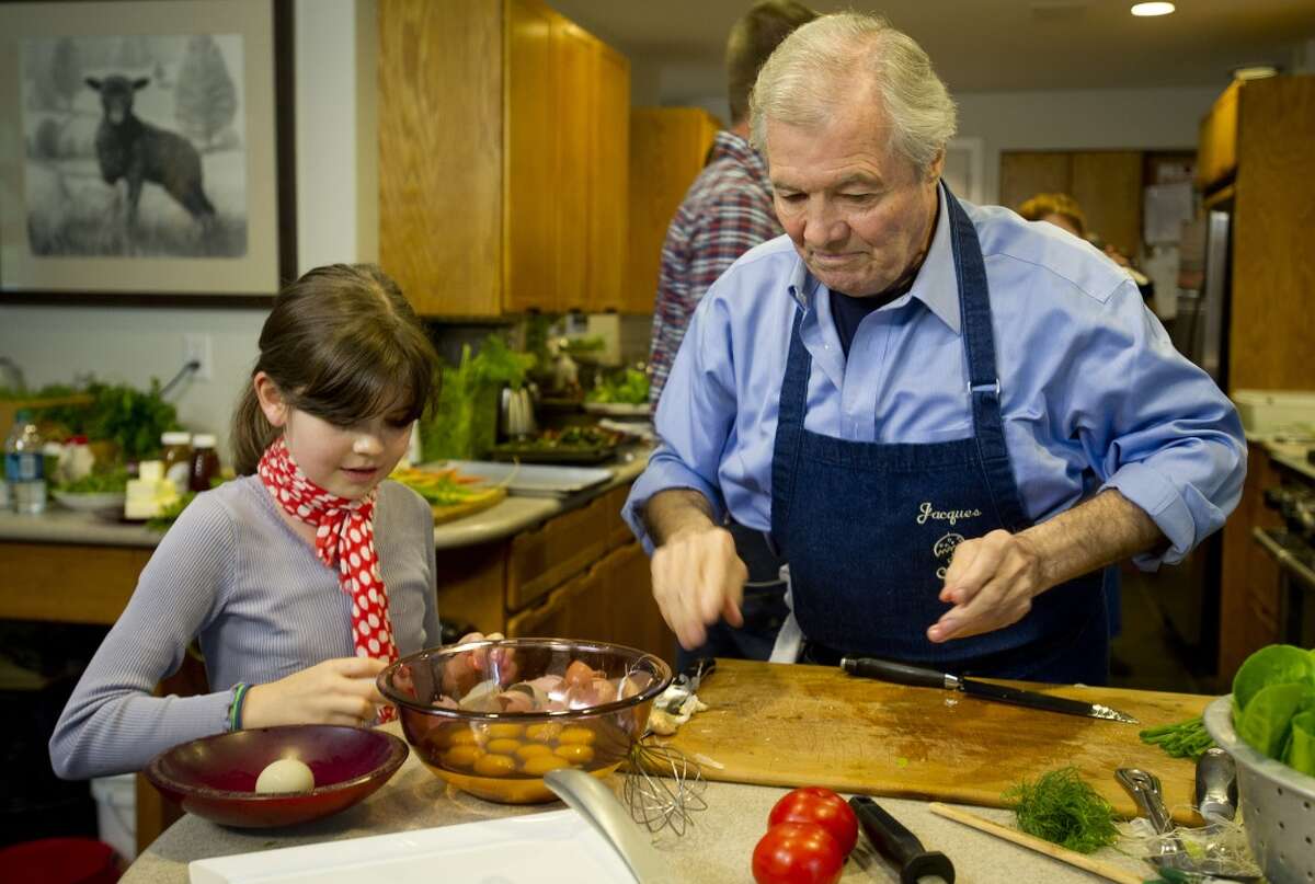 Chef Jacques Pepin cooks with his granddaughter, Shorey, during a taping of "Moveable Feast with Fine Cooking" for Public Television at Millstone Farms in Wilton, Conn., on Friday, June 7, 2013.