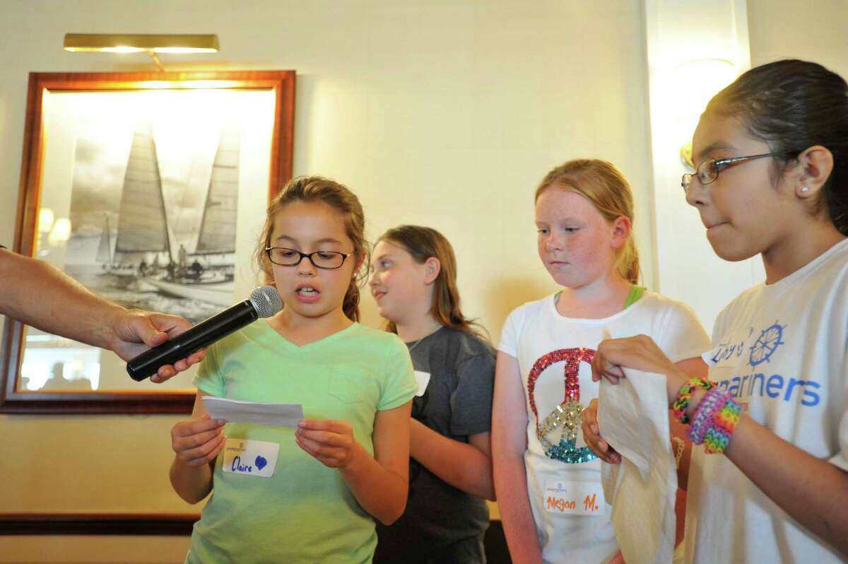 Claire Salerno speaks as her classmates from Stark Elementary School listen from left Mackenzie McInerney, Megan McQuillan and Lubymichelle Chuco, during the graduation festivities for students from the Young Mariners Foundation at the Stamford Yacht Club on Tuesday, June 11, 2013.