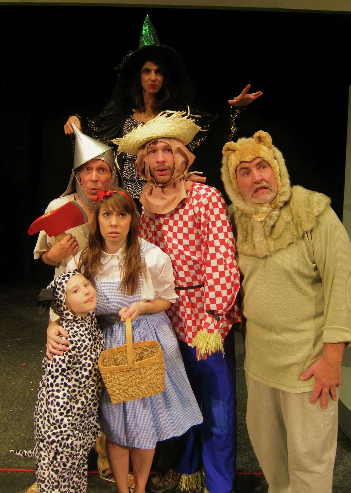 Toto (Caroline Whitaker), Dorothy (Kathryn Starczewski); middle: Tin Woodman (Alan Edstrom), Scarecrow (Conrad Browne Lorcher), Lion (Pat Leathem); back: Wicked Witch of the West (Gloria Ford) in Home Made Theater's production of "The Wizard of Oz," through Dec. 15, 2012. (Home Made Theater)