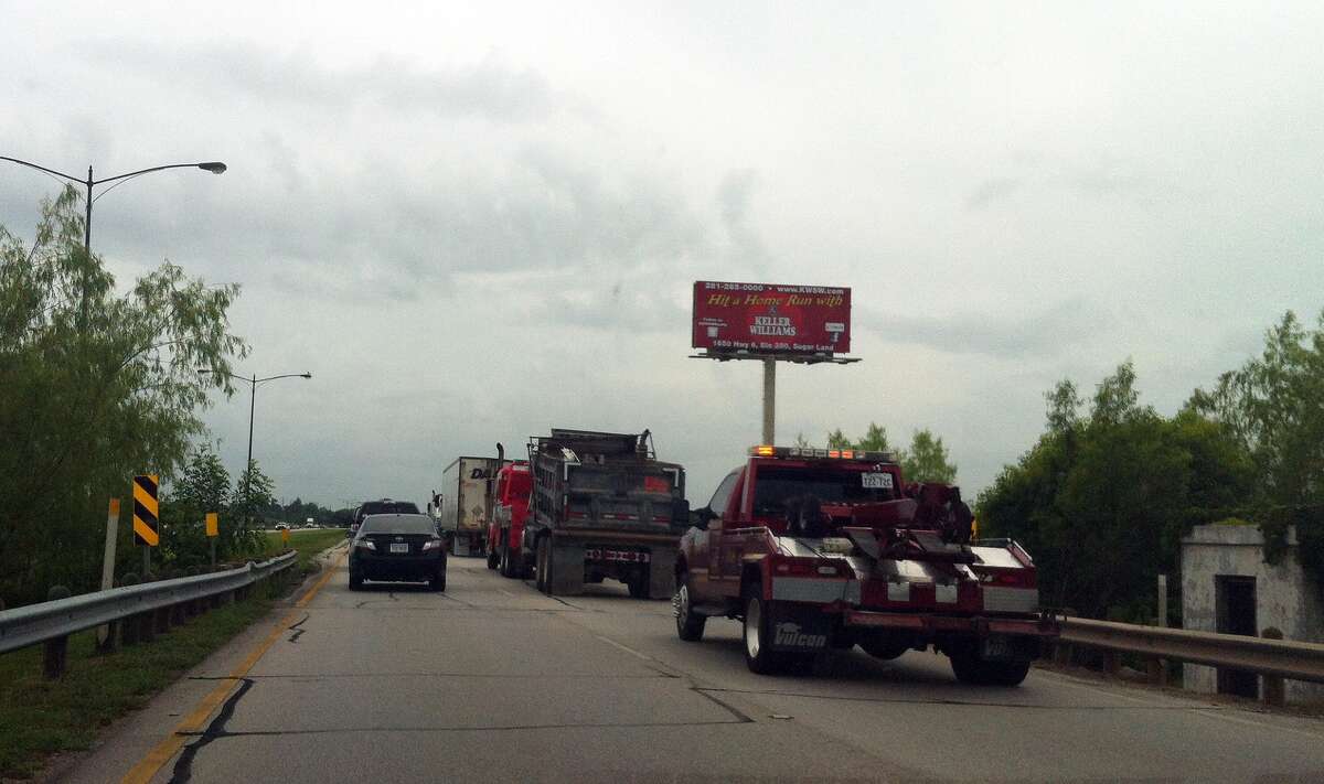 US 90 in Sugar Land shut down after dump truck hits big rig