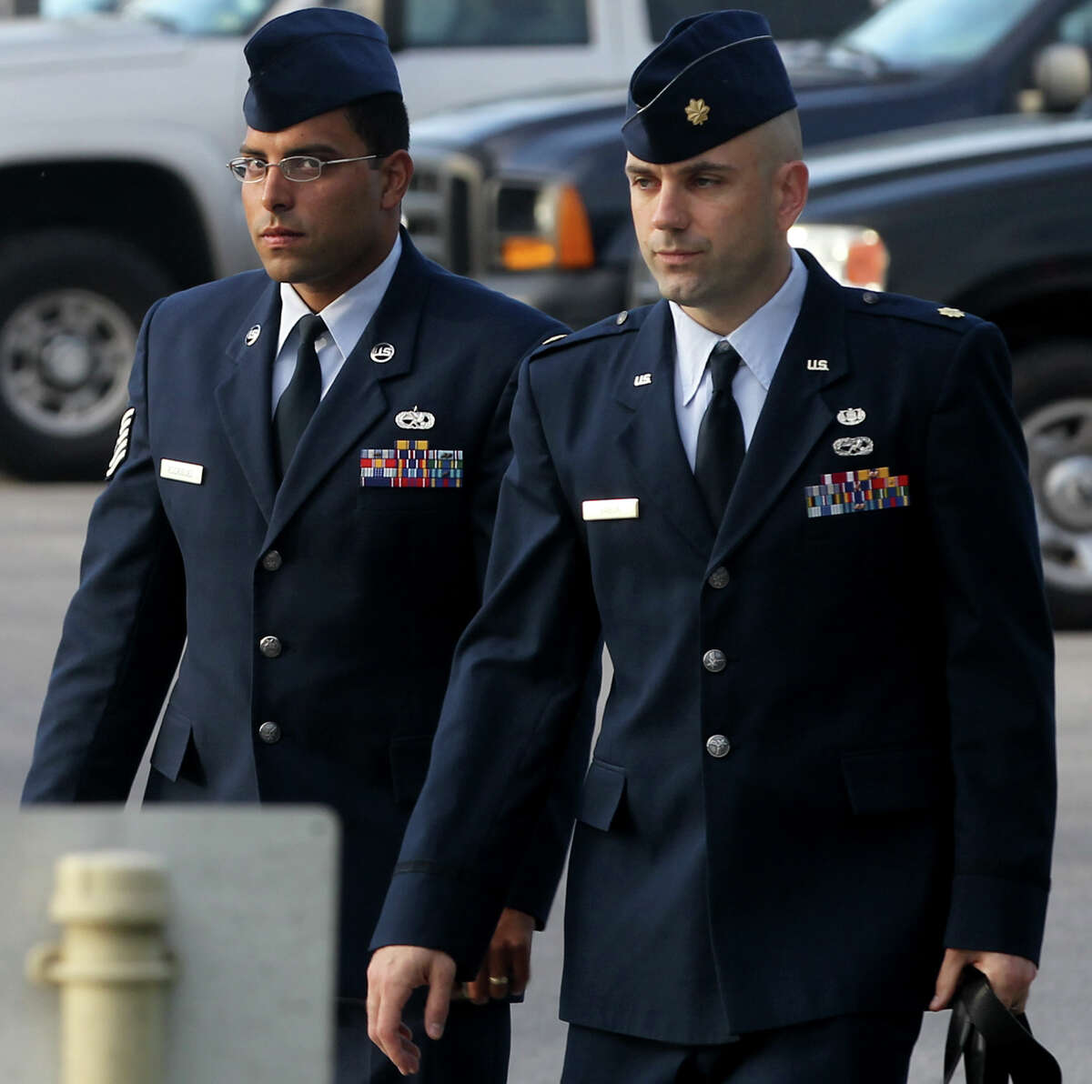 Air Force Tech Sergeant Jaime Rodriguez (left) heads for court Thursday June 6, 2013 at Joint Base San Antonio-Lackland. He is accused of having illicit contact with 18 women, and having sex with four of them.