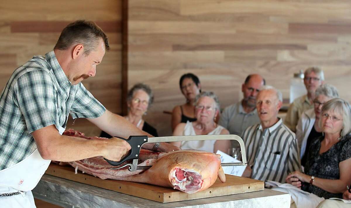 Rian Rinn of Sonoma County Meat Co. shows how to butcher a hog.