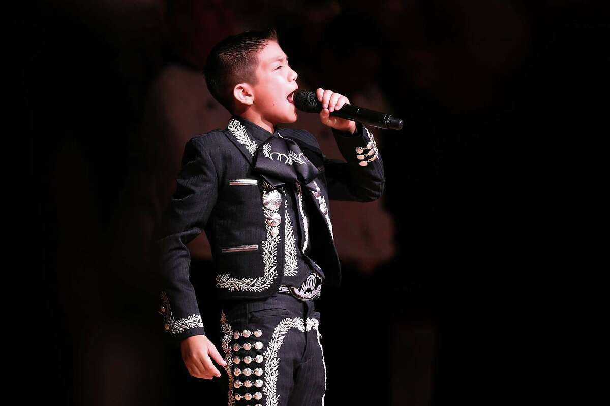 Singer Sebastien De La Cruz performs the United States national anthem before Game Four of the 2013 NBA Finals between the San Antonio Spurs and the Miami Heat at the AT&T Center on June 13, 2013 in San Antonio, Texas.