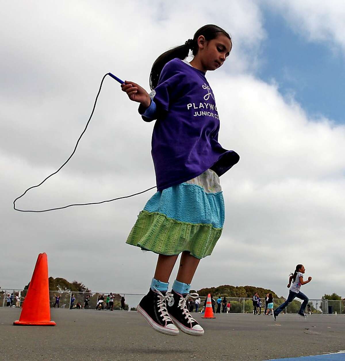 Ana Villareal 9 a Montalvin Elementary School student takes part in recess sponsored by PlayWorks, a nonprofit that promotes exercise at a number of Bay-Area schools Wednesday, June 5, 2013 in San Pablo Calif. At a time when recess and other play time is under pressure to make more time for test preparation and basic academics, a nonprofit is working hard to explain how schools can make recess count. PlayWorks works in a number of Bay Area schools to coach kids to improve the school-learning environment by explaining why play matters. The results are a decrease in bullying and aggressive actions and an uptick in academic performance.