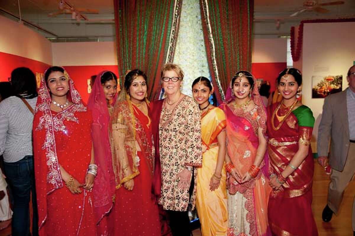 Pat Jasper, center, and models show wedding attire for a traditional Indian wedding.