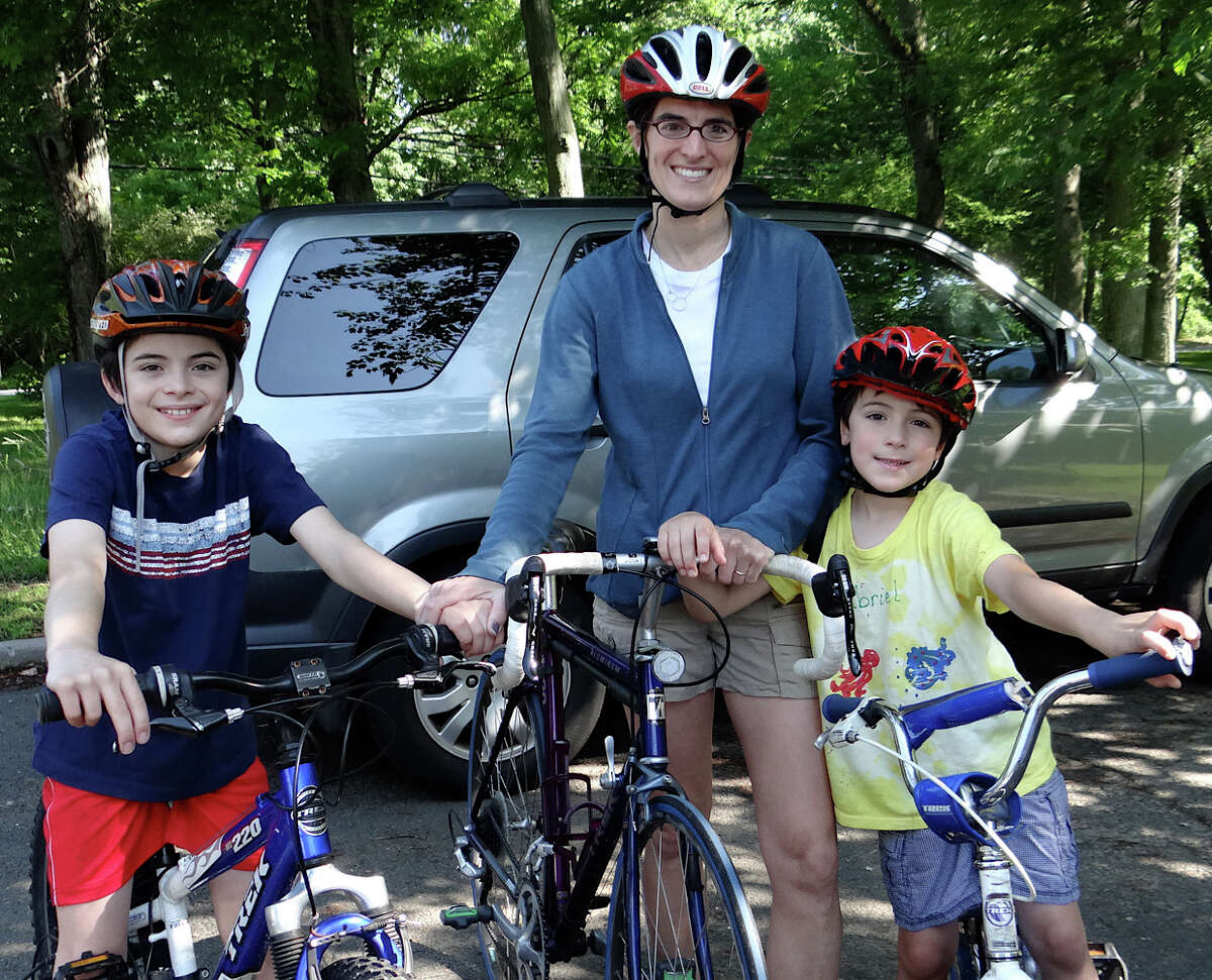 Selectman Cristin McCarthy Vahey with sons, Daniel, 10, and Gabriel, 6, at the ribbon-cutting ceremony for Fairfield's new bike route Saturday.