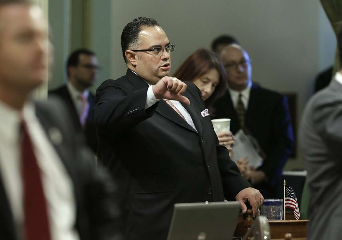 Assembly Speaker John Perez, D-Los Angeles, gives a thumbs down as he votes against a proposed Republican amendment to one of the state budget "trailer bills" Friday, June 14, 2013 in Sacramento, Calif. Both houses of the Legislature approved the $96.3 billion budget plan on party line votes: 28-10 in the Senate and 54-25 in the Assembly.(AP Photo/Rich Pedroncelli)