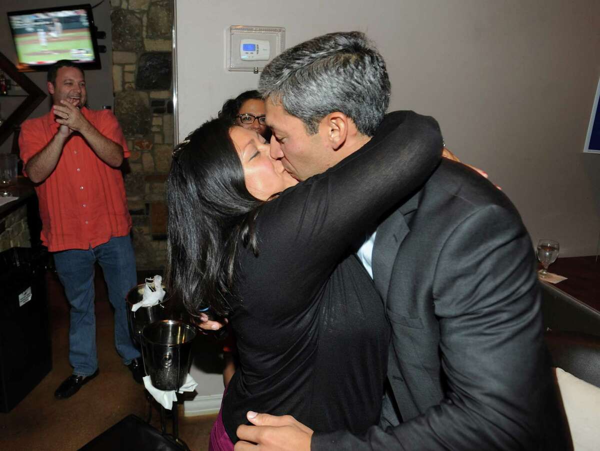City Councilman-elect Ron Nirenberg kisses his wife, Erika Prosper, at his election watch party at Franco's Pizza on Saturday, June 15, 2013.