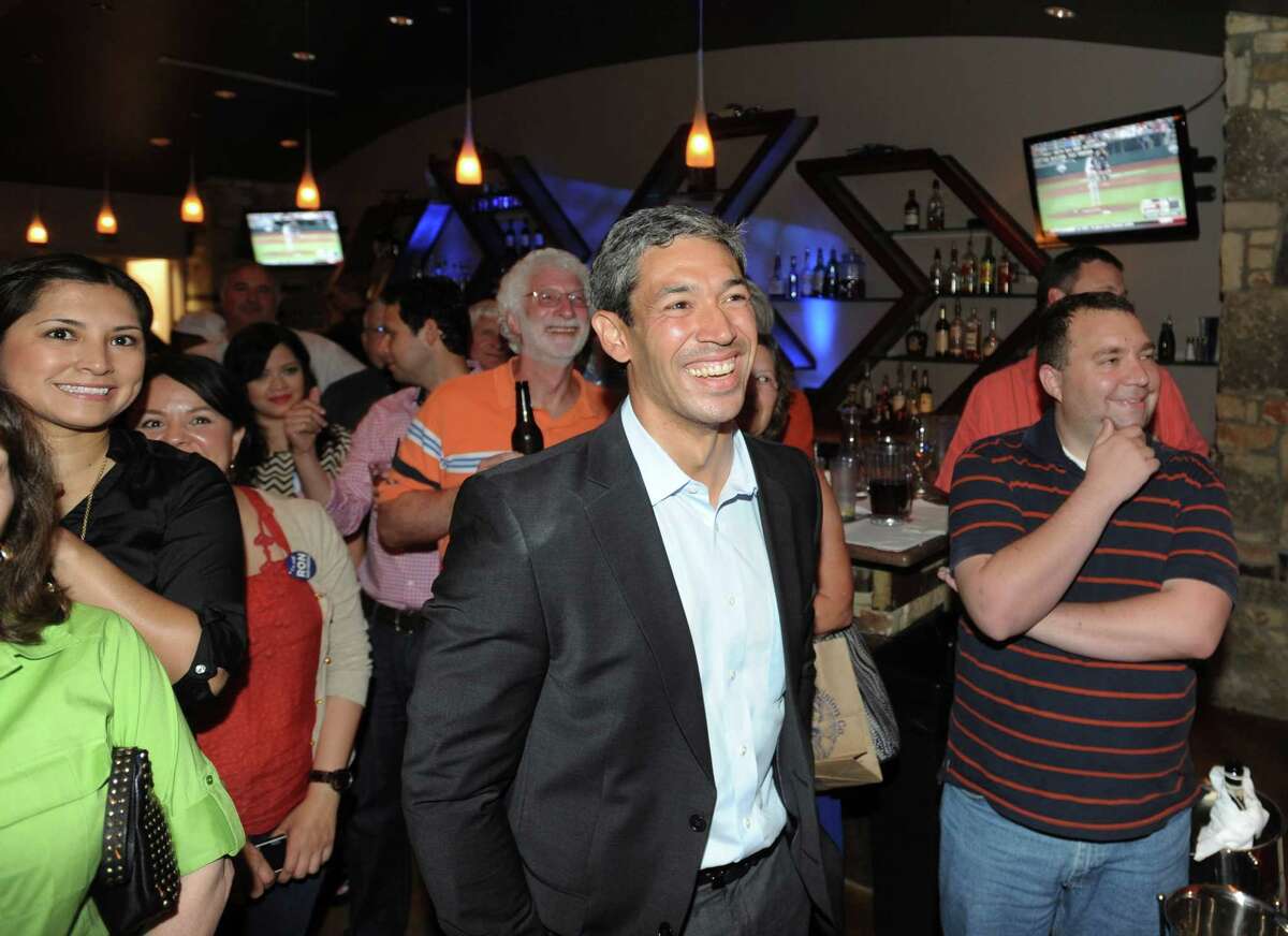 City Councilman-elect Ron Nirenberg listens as his wife, Erika Prosper, speaks about him at his election night watch party at Franco's Pizza on Saturday, June 15, 2013.