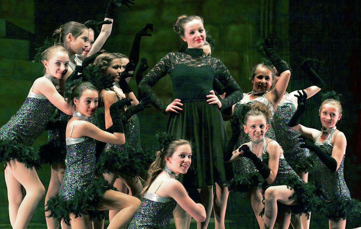 The jazz 3B class performs to "Cruella deVille" and choreography by Gina Silva during Studio D's presentation of "Cinderella - In Motion," May 4, 2013 at New Milford High School.. Above, Alexis Yancoskie,center, portrays the evil stepmother, surrounded by, counter clockwise, Abbi Debes,, Lindsey Johanson, Sheah Tooley, Carolyn Gevinski, Gabby Esposito, Caitlin Chemero,all of New Milford, Elizabeth Hawley of Bridgewater, Ashley Mulhare and Hannah Lasky of Roxbury, Caroline Johnson of South Kent, and ulia Venezia and Marina Prontelli of New Milford.