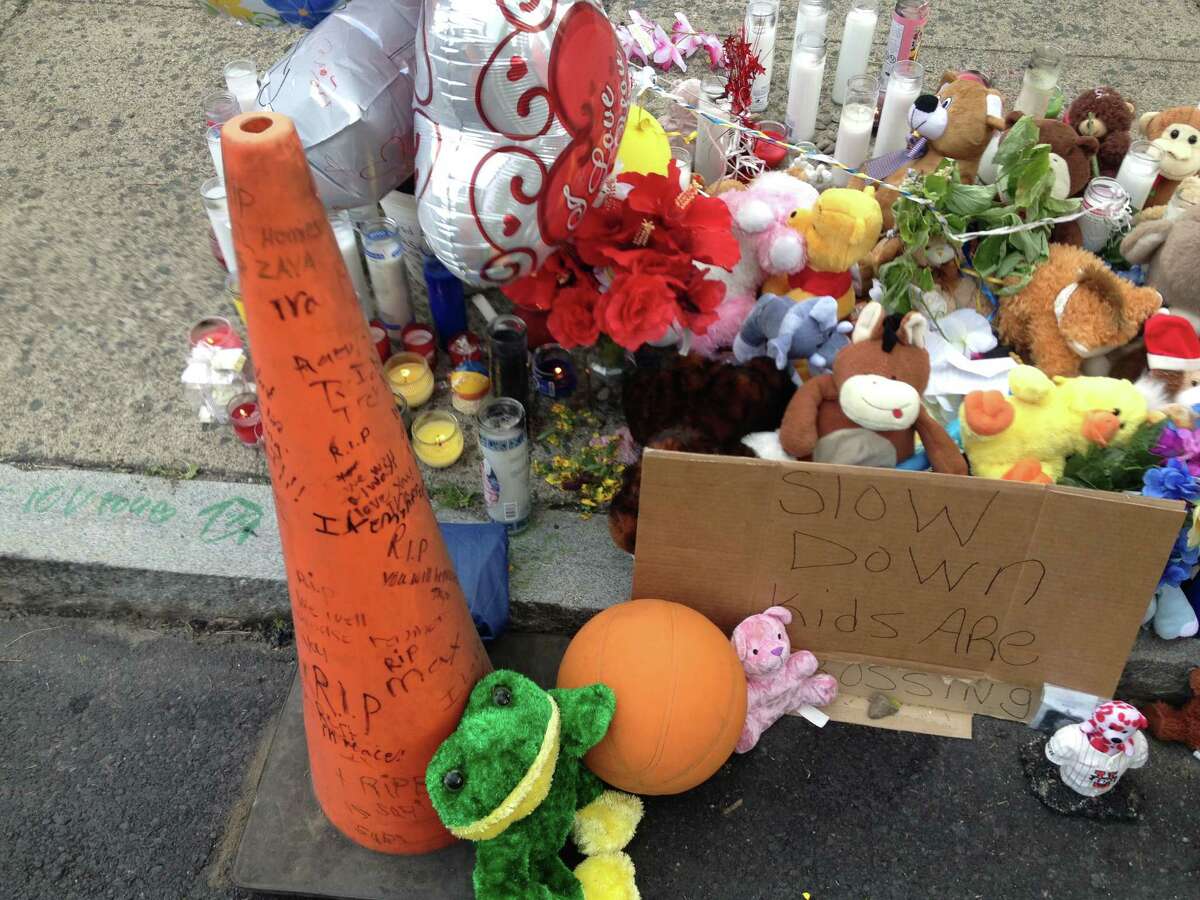 A memorial for Qazir Sutherland, the 7-year-old boy who died after he was hit by a car on South Pearl Street on Saturday is being built in front of 628 South Pearl St. (Bryan Fitzgerald / Times Union)