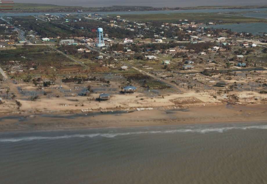 Oblique aerial photography of Crystal Beach, on the Bolivar Peninsula on September 15, 2008, two days after landfall of Hurricane Ike (bottom).