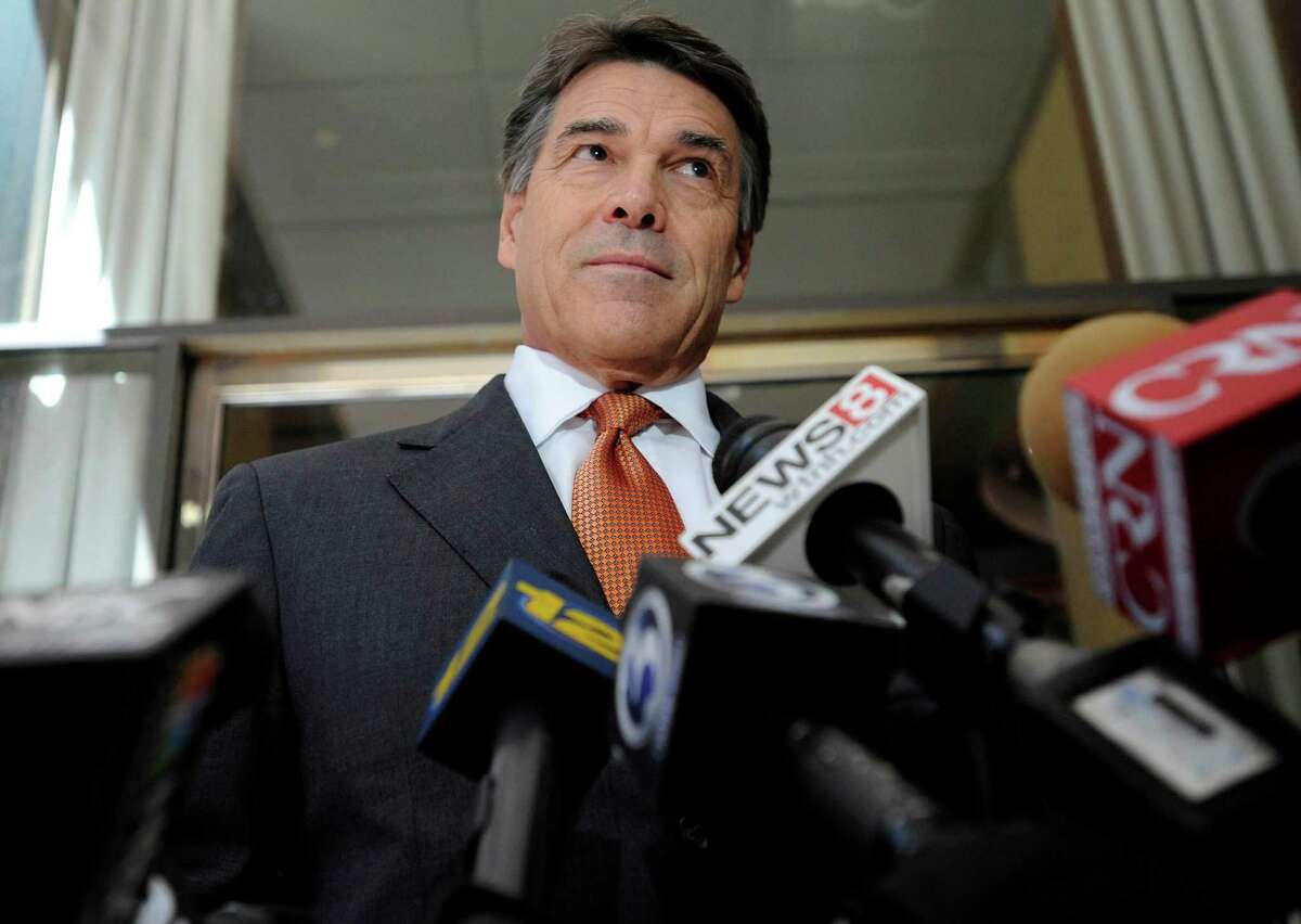 Texas Gov. Rick Perry speaks to the media before hosting a lunch appointment with Connecticut gun makers in Hartford, Conn., Monday, June 17, 2013. The governors of Texas and South Dakota are visiting Connecticut to court local gun makers, many of which have threatened to leave since the state passed tough new gun-control laws in response to the massacre at Sandy Hook Elementary School.