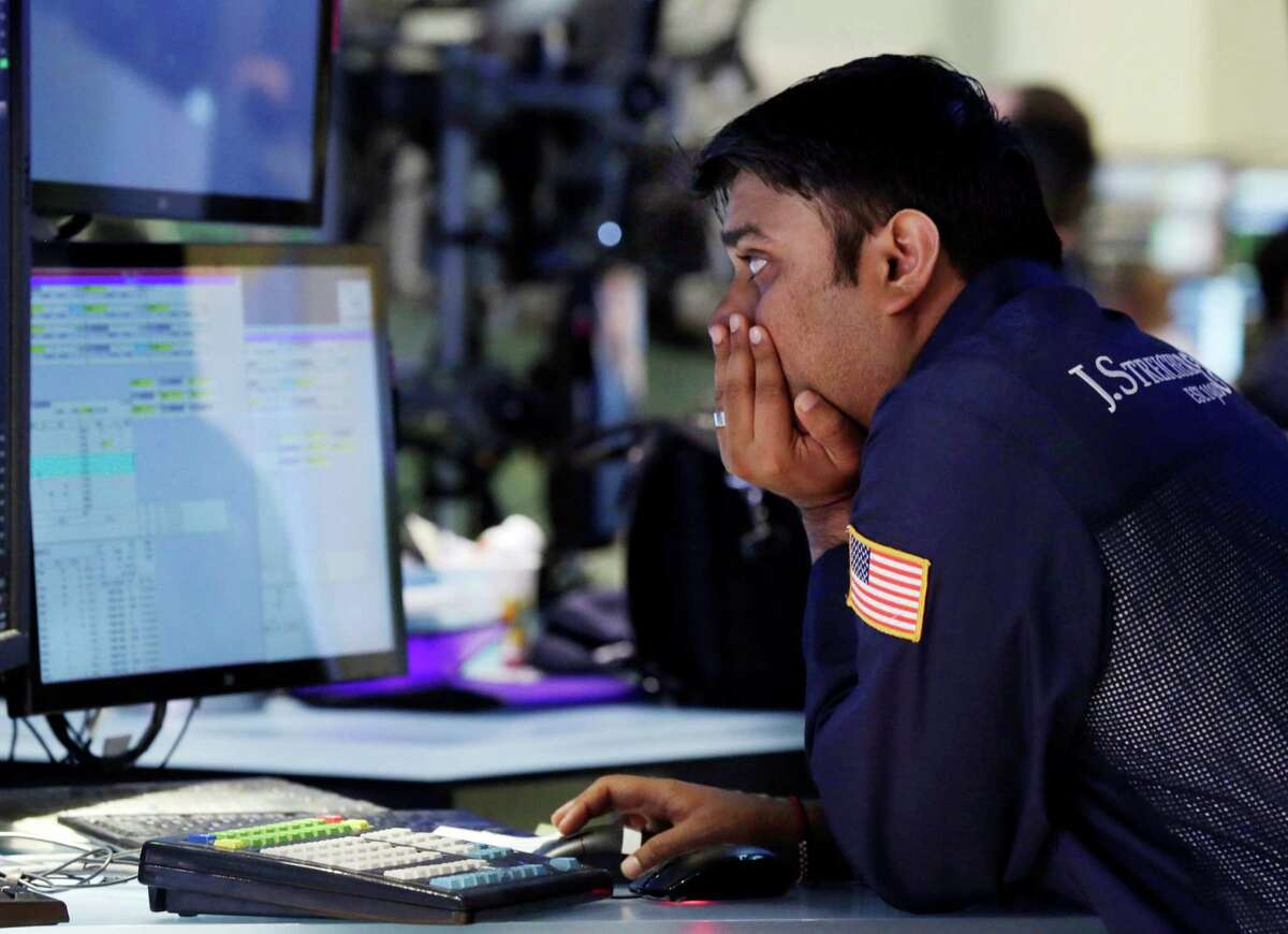 Specialist Niral Doshi works at his post on the floor of the New York Stock Exchange Monday, June 17, 2013. Stocks were up Monday because investors think Fed leaders will determine that the economy isn't recovering fast enough. (AP Photo/Richard Drew)