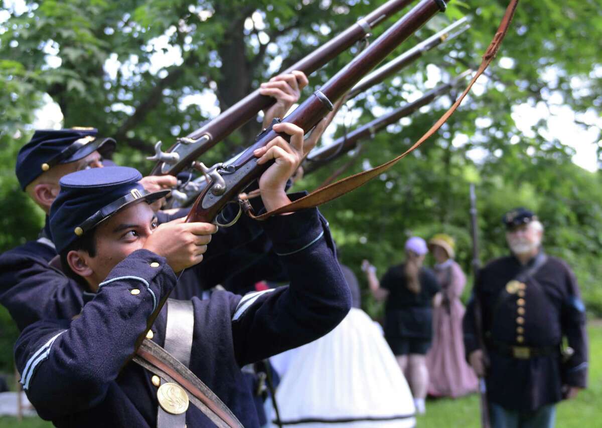 Jake Dillon, of Brookfield, practices a march routine with other re-enactors from the 11th Regiment of Connecticut during the Living History Civil War re-enactment at the Little Red School House in New Fairfield, Conn. on Saturday, June 15, 2013.