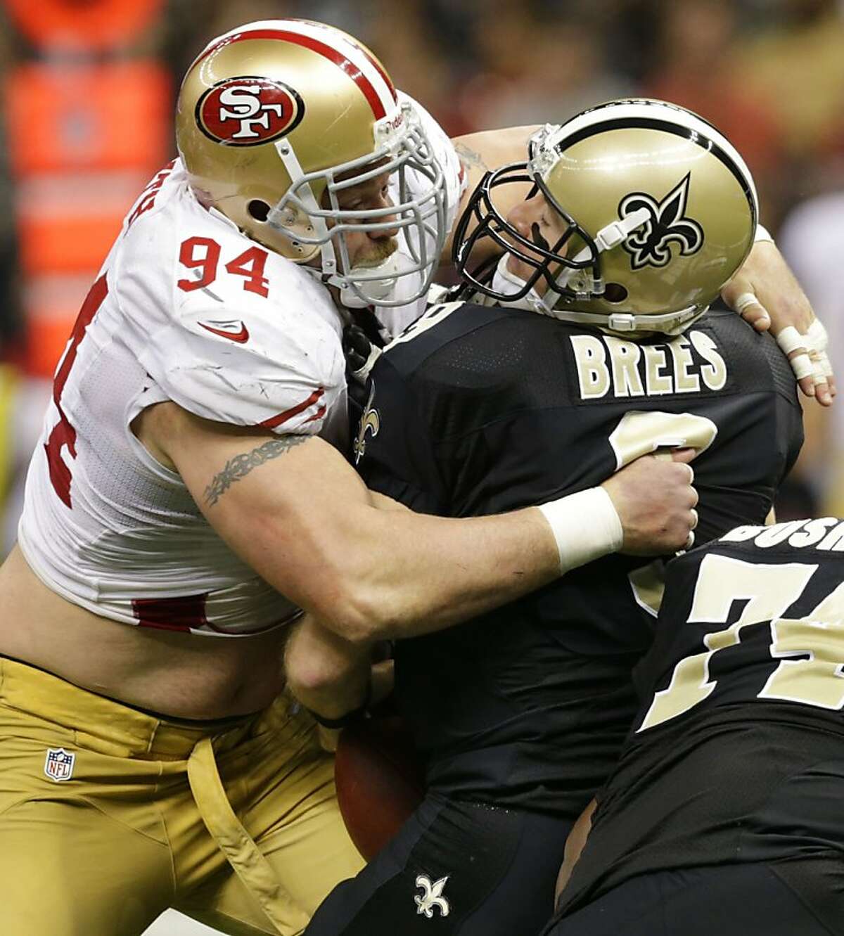 Saints49ers1933.jpg San Francisco 49ers defensive end Justin Smith (94) sacks New Orleans Saints quarterback Drew Brees (9) in a game between the New Orleans Saints and San Francisco 49ers at the Mercedes-Benz Superdome in New Orleans, La., Sunday, Nov. 25, 2012. (By MATTHEW HINTON /SPECIAL TO THE CHRONICLE