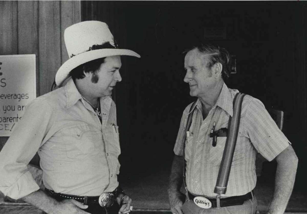 Mickey Gilley, left, and Sherwood Cryer, owner of Gilley's Club, shot in June 20, 1980 in Pasadena. HOUCHRON CAPTION (05/15/2005) SECNEWS: ORIGINALS: Mickey Gilley, left, handled the singing and Sherwood Cryer ran Gilley's when this photo was taken at the Pasadena club in 1980.