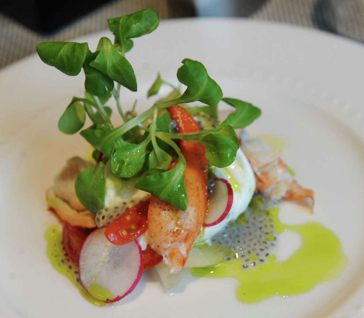 Lobster and burrata, tomato, pickled pear, radish, and basil oil is under starters on the menu at Tala American Bistro on Thursday, June 13, 2013 in Latham, N.Y. (Lori Van Buren / Times Union)