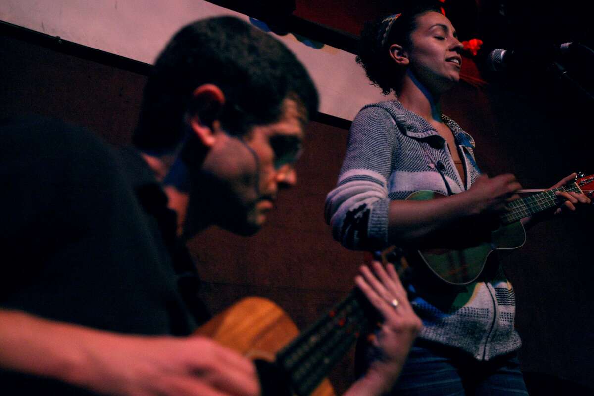 Joshua Zucker (left), and Vessna Scheff (right) play together at the weekly open mike held at Hotel Utah on Monday, June 17, 2013 in San Francisco, Calif.