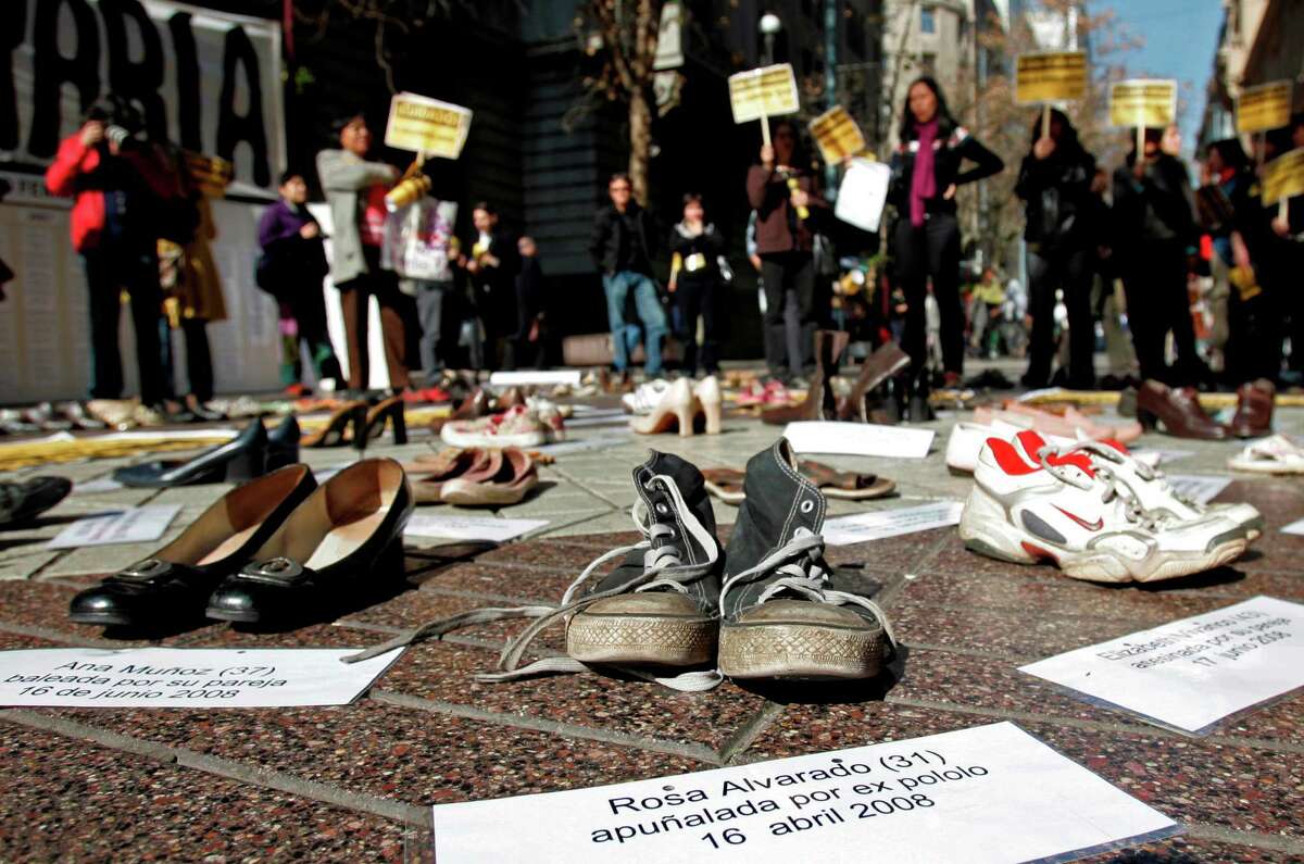In this Thursday, July 30, 2009 file photo Shoes representing female victims of violence are displayed by protesters from the Chilean Network Against Domestic and Sexual Violence in Santiago. The sign at bottom reads in Spanish "Rosa Alvarado, 31, stabbed by ex-boyfriend, 16 April 2008." About a third of women worldwide have been physically or sexually assaulted by a former or current partner, according to the first major review of violence against women. In a series of papers released on Thursday June 20, 2013 by the World Health Organization and others, experts estimated nearly 40 percent of women killed worldwide were slain by an intimate partner and that being assaulted by a partner was the most common kind of violence experienced by women. (AP Photo/Santiago Llanquin, File)