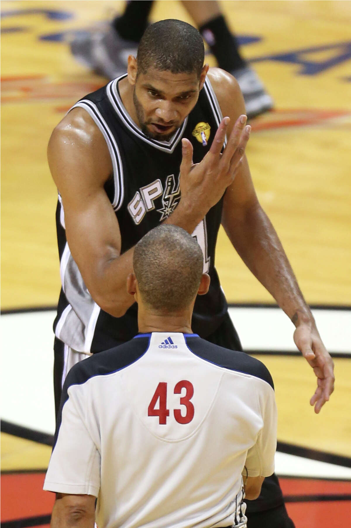 San Antonio Spurs' Tim Duncan argues a call with referee Dan Crawford during the first half of Game 7 of the NBA Finals at American Airlines Arena on Thursday, June 20, 2013 in Miami. (Jerry Lara/San Antonio Express-News)
