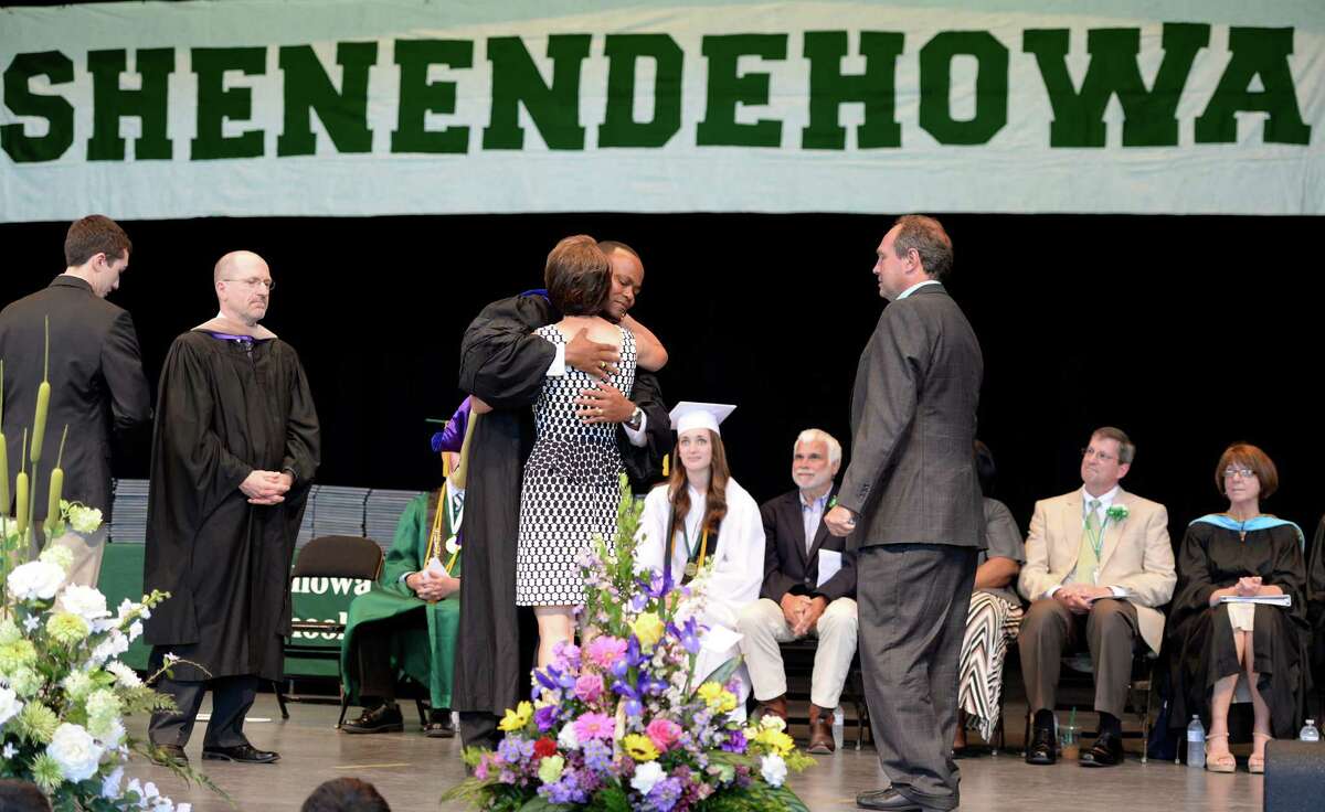 The family of crash victim Chris Stewart is warmly greeted by Oliver Robinson, Shenendehowa superintendent, during the commencement ceremony held at the Saratoga Performing Arts Center June 21, 2013 in Saratoga Springs, N.Y. (Skip Dickstein/Times Union)