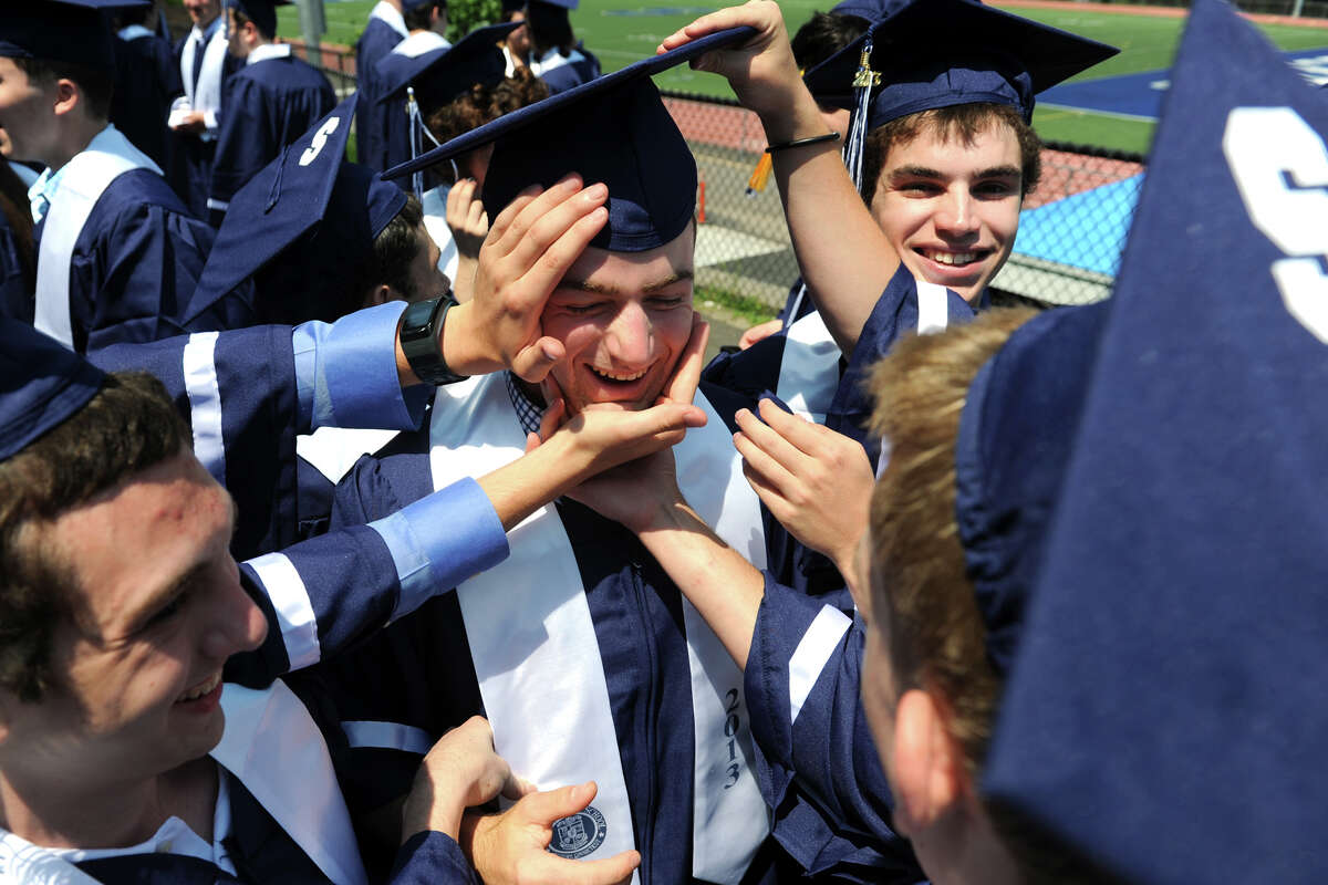 Nick Paparo clowns around with classmates prior to Commencement Exercises for the Staples High School Class of 2013, in Westport, Conn., June 21st, 2013