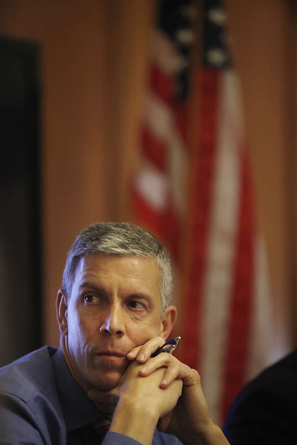 U.S. Secretary of Education Arne Duncan listens to speakers during a roundtable discussion where Mayor Ed Lee and Treasurer Jose Cisneros announced 1,000 savers in Kindergarten to College accounts at City Hall on Friday, June 21, 2013 in San Francisco, Calif.