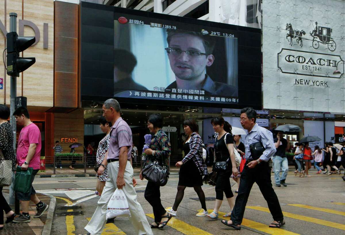 A Hong Kong television screen shows news about Edward Snowden, the former NSA employee now charged in the leaking of top-secret U.S. documents.