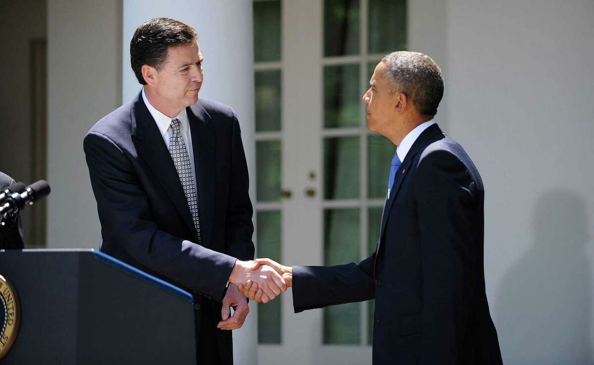 President Barack Obama (right) nominated James Comey, a former senior Justice Department official, to replace Robert Mueller as FBI director.
