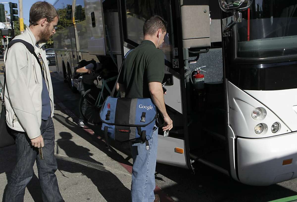 Google employees board a private shuttle bus at 18th and Dolores streets in San Francisco, Calif. that will transport them to Silicon Valley on Friday, June 14, 2013.