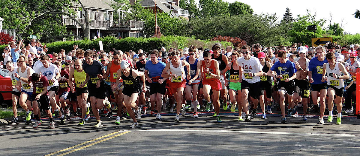 More than 1,000 runners surge from the starting line Saturday morning at Jennings Beach for the annual Fairfield Road Races 5K run.