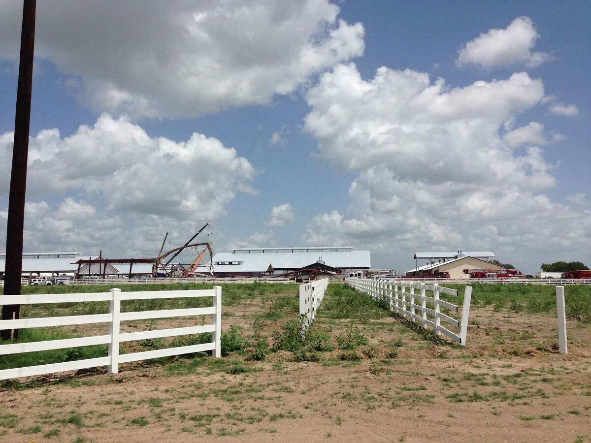 This photo provided by KBTX-TV shows damage to the Texas A&M University equestrian center on Saturday, June 22, 2013 near College Station, Texas. A portion of the equestrian center under construction has collapsed. KBTX-TV reports some workers were hurt in Saturday morning's accident but that everyone has been accounted for. A&M spokesman Lane Stephenson confirmed there had been an accident at the equestrian center on university property about a mile from the College Station campus. (AP Photo/KBTX-TV, Alex Lotz)