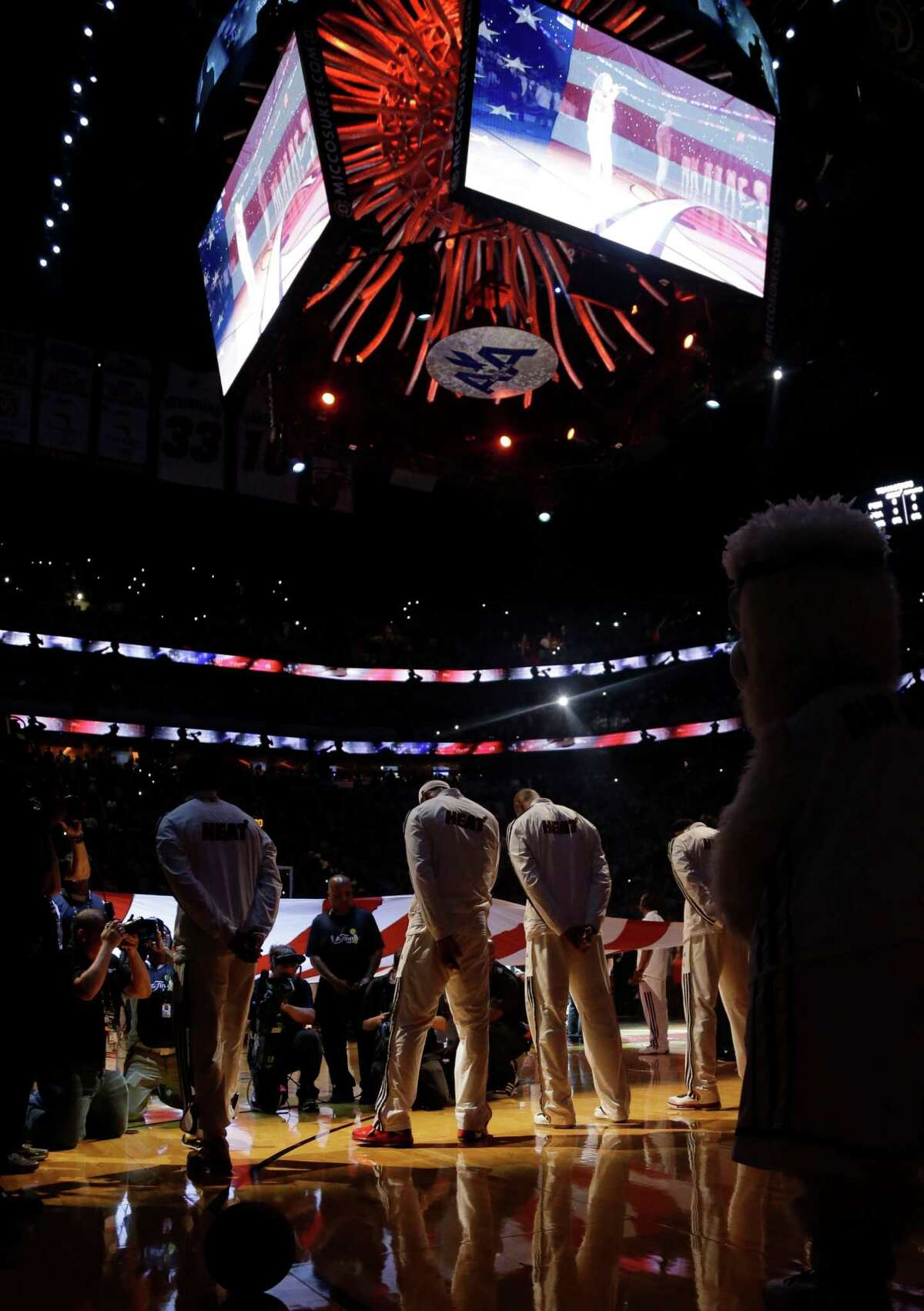 The Miami Heat team during the singing on the National Anthem in Game 7 of the NBA basketball championships between the Miami Heat and the San Antonio Spurs, Thursday, June 20, 2013, in Miami. (AP Photo/Lynne Sladky)