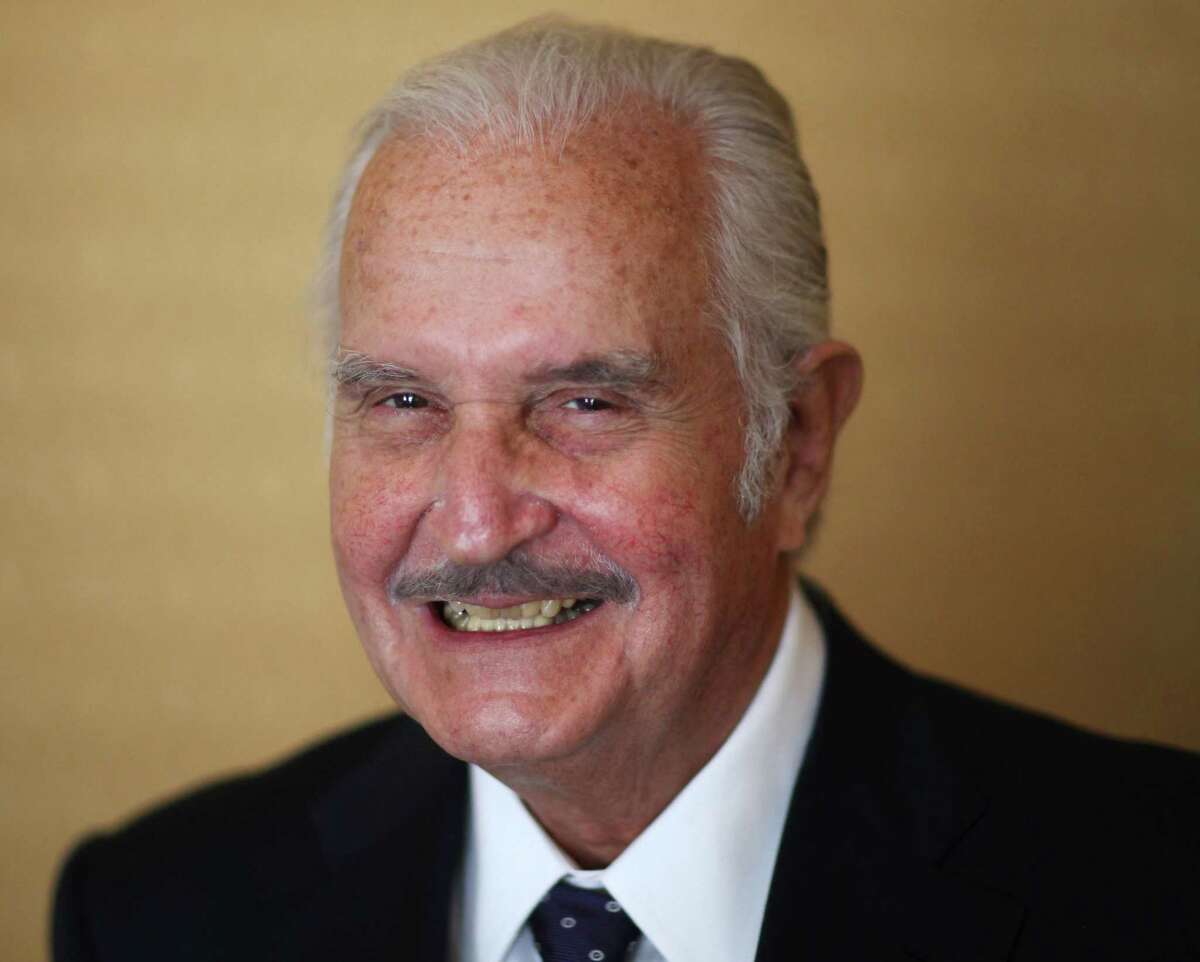FILE - In this March 12, 2012 file photo, Mexican author Carlos Fuentes poses for a photo after a press conference in Mexico City. FBI documents, posted on their website Thursday, June 20, 2013, show that the bureau and the U.S. State Department kept close track of Fuentes, considered a Communist and sympathizer of Cuba's Fidel Castro. The United States denied Fuentes an entry visa at least twice in the 1960s. He died on May 15, 2012. (AP Photo/Alexandre Meneghini, File)