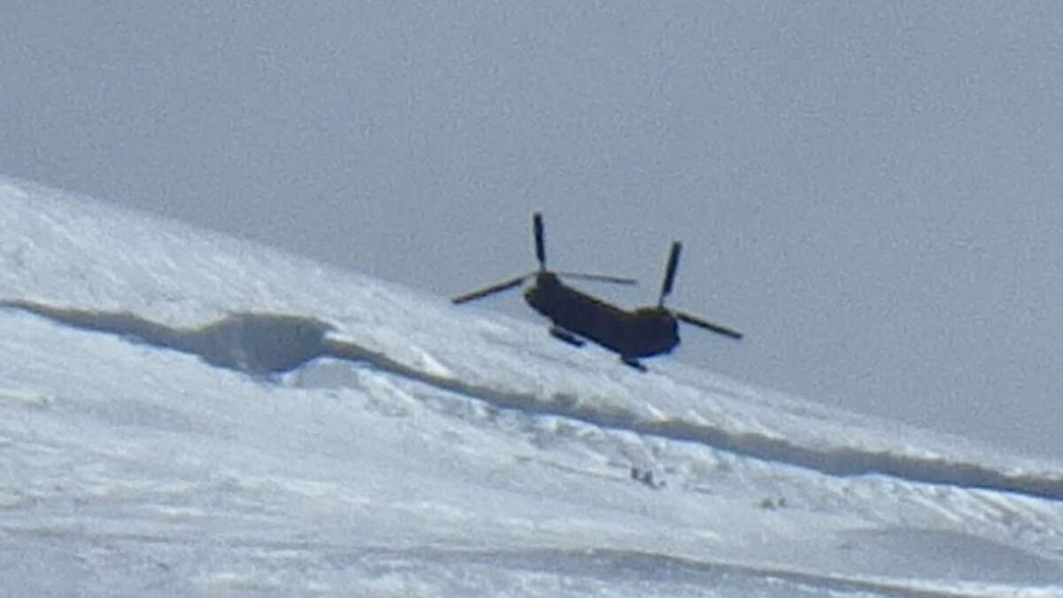 Army Chinook over the top of four Texans being rescued on Mount Rainier (by Claire Kultgen) June 21, 2012