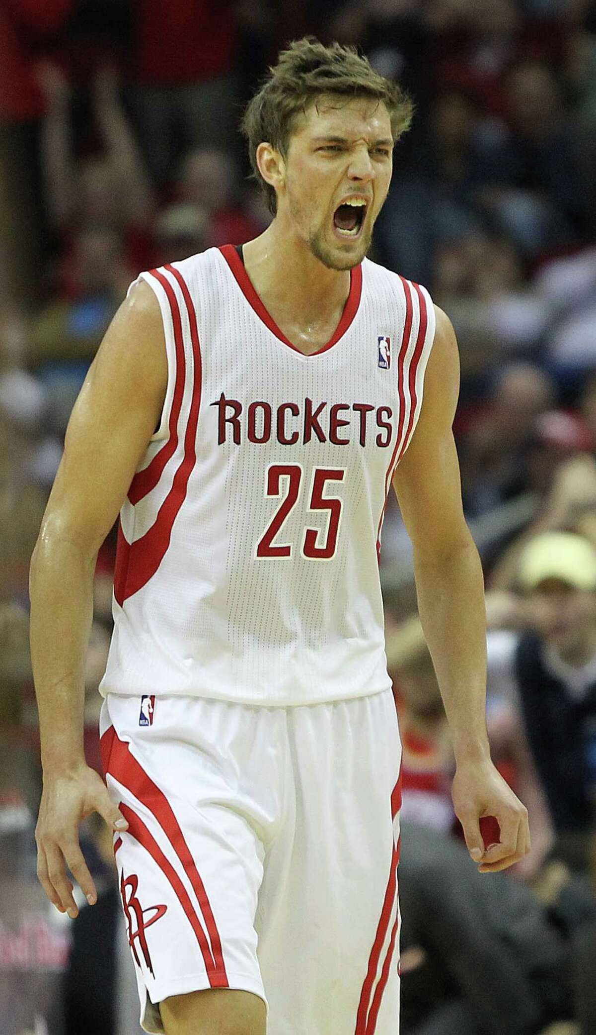 Chandler Parsons (25) screams after James Harden (13) scored a basket and was fouled during the fourth quarter of a NBA basketball game, Saturday, Feb. 2, 2013, in Toyota Center in Houston. ( Nick de la Torre / Chronicle )