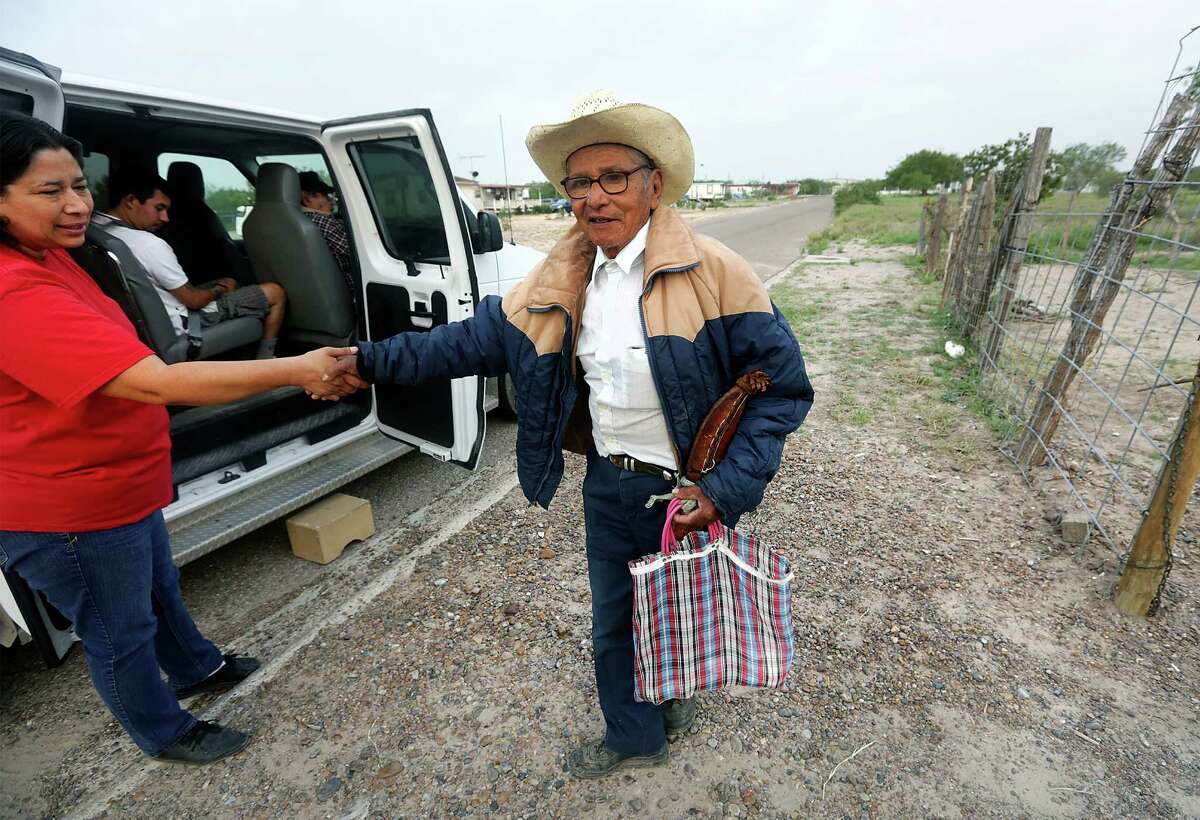 Rio Grande Valley resident Panchito Tovar, right, is greeted by Home Away from Home Adult Daycare driver Elizabeth Hernandez, on Wednesday, May 22, 2013.
