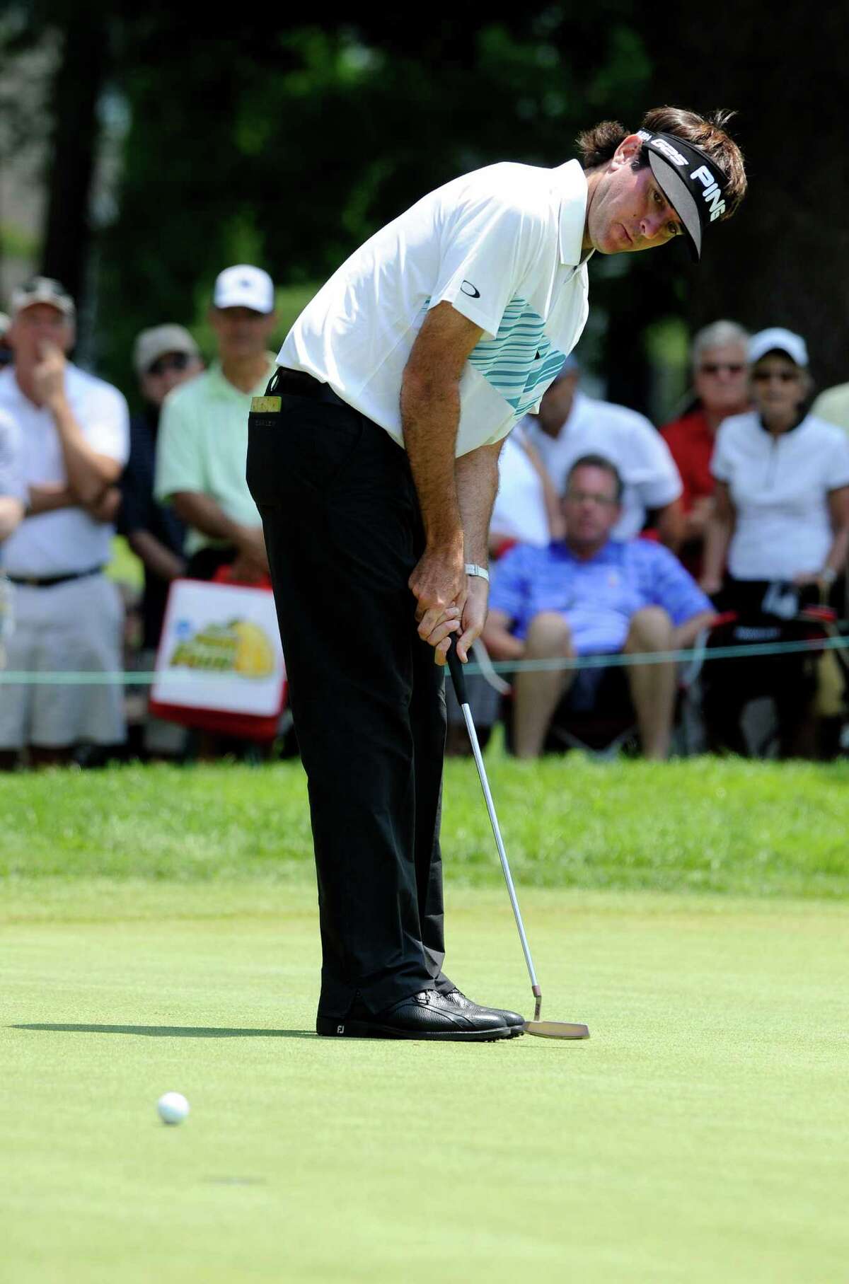 Bubba Watson watches his putt on the seventh green during the second round of the Travelers Championship golf tournament in Cromwell, Conn., Friday, June 21, 2013. Watson shot a 3-under par 67 in his round, to go 10-under par for the tournament. (AP Photo/Fred Beckham)