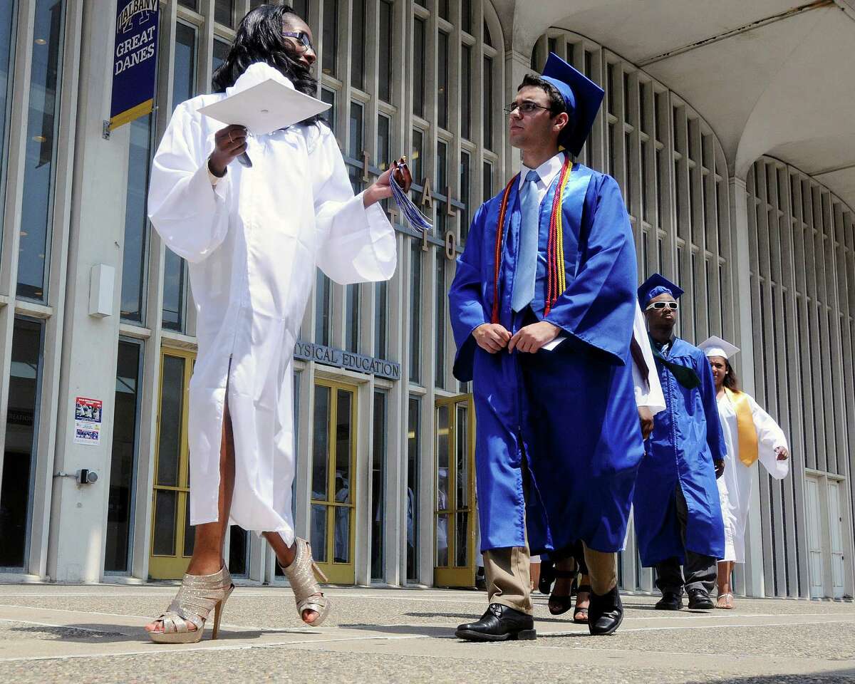 Students walk to the start of the Albany High School commencement exercises inside the SEFCU Arena on the University at Albany campus Albany, N.Y., Sunday, June 23, 2013. (Hans Pennink / Special to the Times Union)