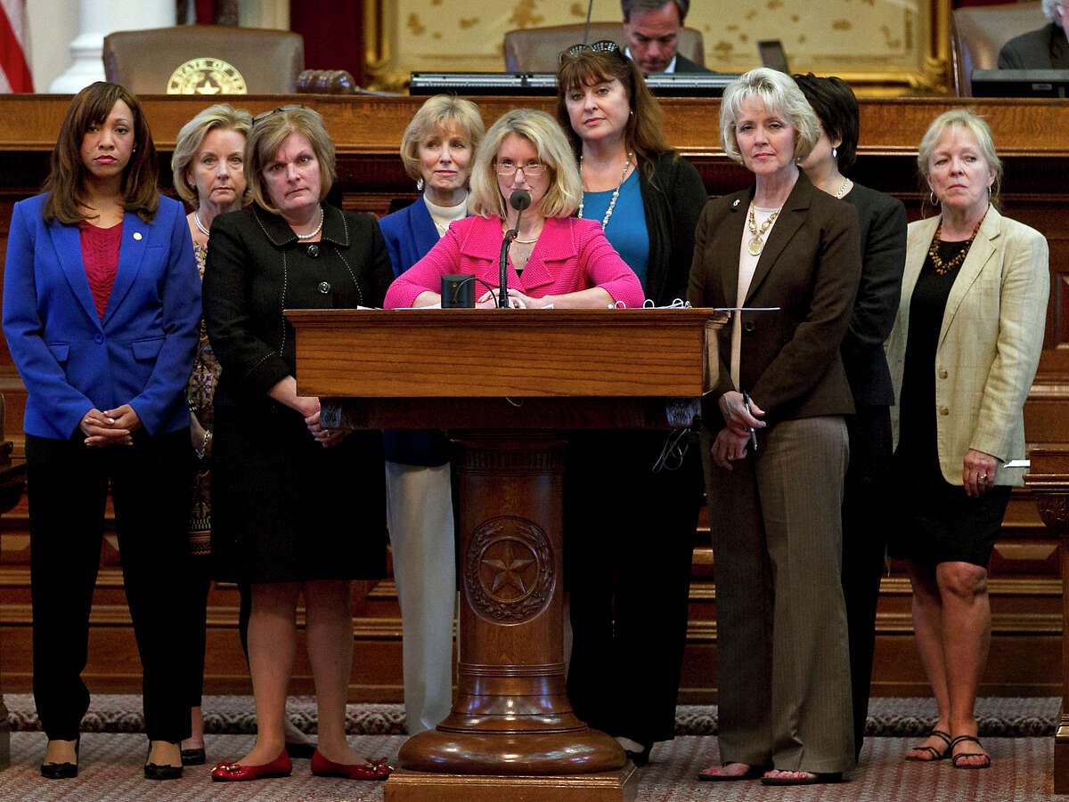 Rep. Jodie Laubenberg, R-Parker, center, sponsor of Senate Bill 5, is flanked by fellow Republicans during the second reading of the abortion bill on the House floor of the Texas State Capitol in Austin, Texas, on Sunday, June 23, 2013. If passed, the bill that would ban abortions after 20 weeks, require that they take place in surgical centers, and restrict where and when women can take abortion-inducing pills, would force 37 out of 42 abortion clinics in Texas to close and undergo millions of dollars in upgrades. (AP Photo/Statesman.com, Rodolfo Gonzalez)
