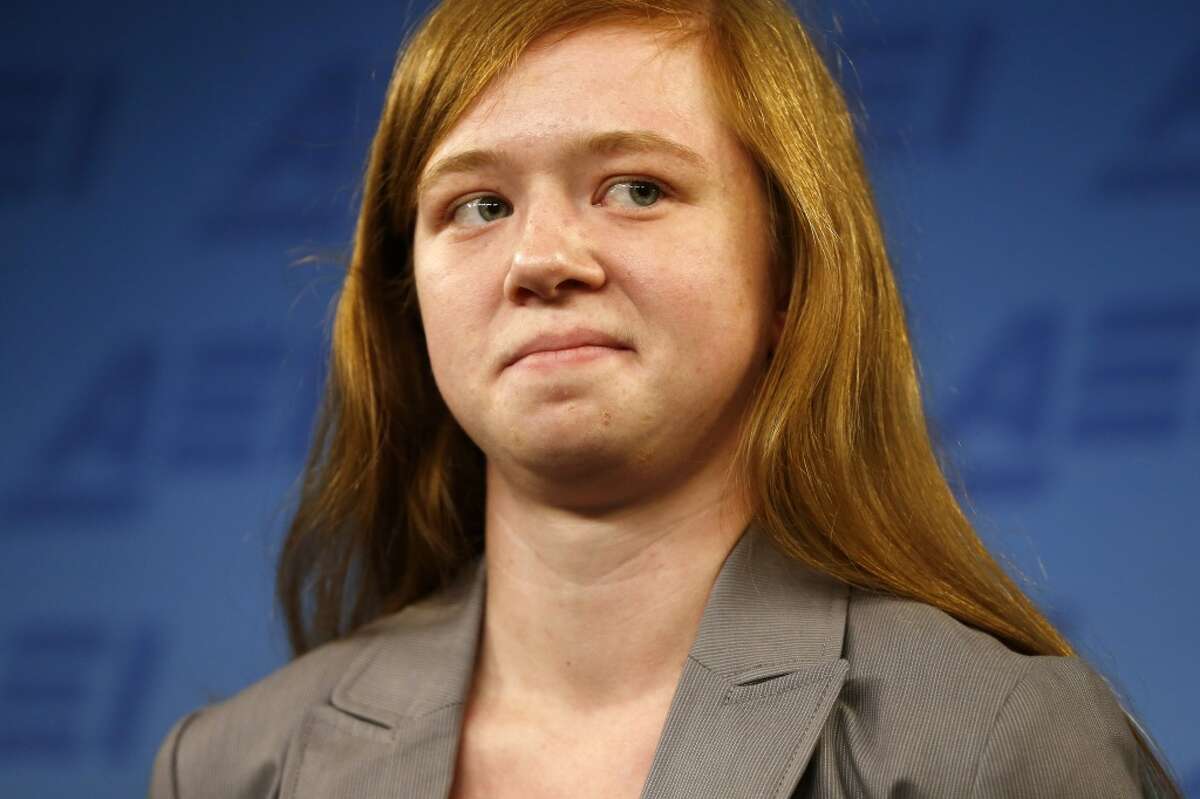 Abigail Fisher, who sued the University of Texas when she was not offered a spot at the university's flagship Austin campus in 2008, stands at a news conference at the American Enterprise Institute in Washington, Monday, June 24, 2013. The U.S. Supreme Court ruling on affirmative action in higher education will have "no impact" on the University of Texas' admissions policy, school president Bill Powers said Monday, noting UT will continue to use race as a factor in some cases. (AP Photo/Charles Dharapak)